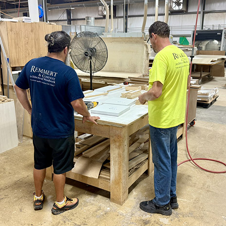 Employee of Remmert and Company works on custom products